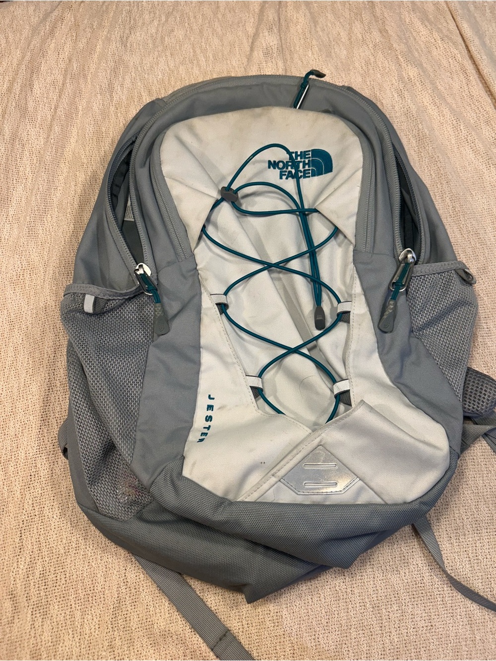 The North Face Gray and Light Gray Jester Backpack with Teal Bungee